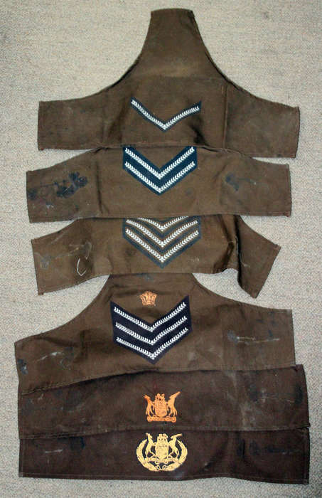 Printed SADF brassards going from Lance corporal to WO1
