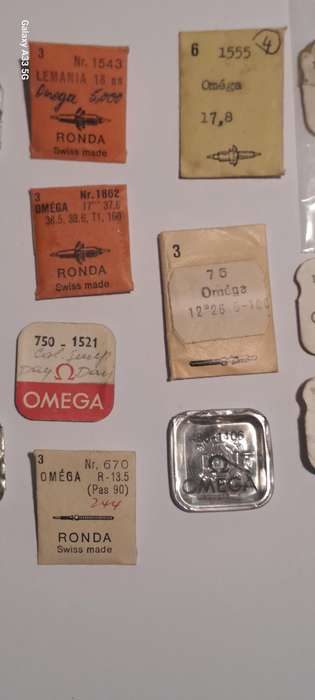 various vintage Omega watch parts