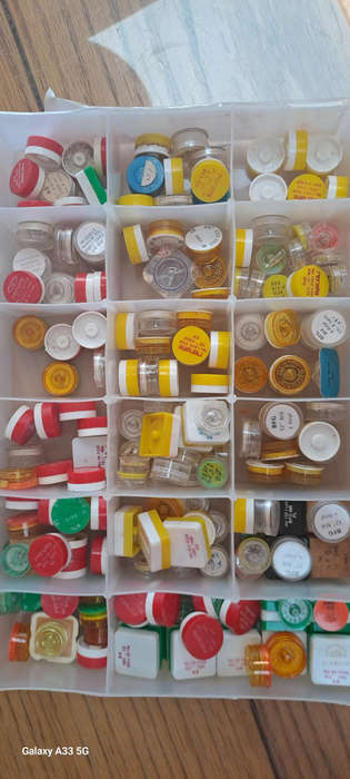 Box of assorted vintage watch balance wheels