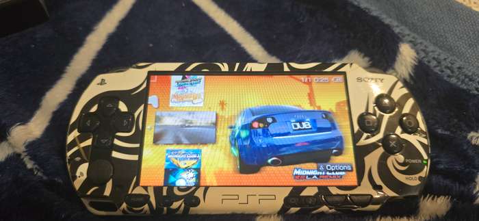 listing 1 PSP 1000 modded 64gb 60+games whiteames loaded