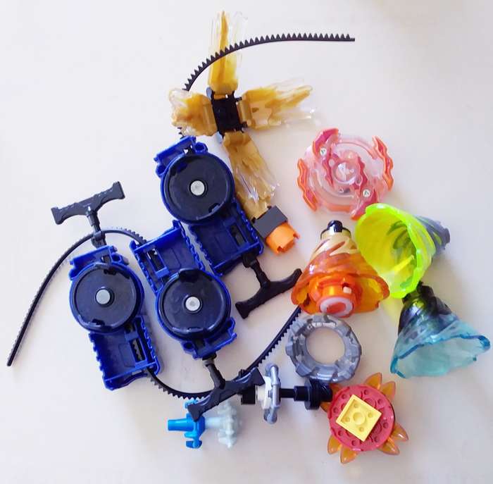 3 Beyblade Launchers with Various Spinners