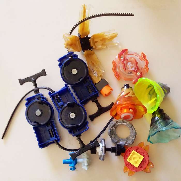 3 Beyblade Launchers with Various Spinners