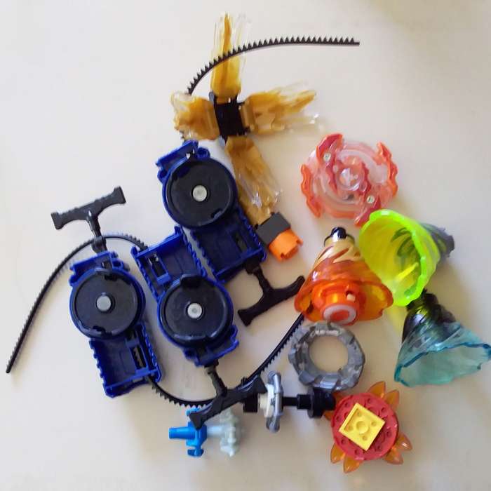 3 Beyblade Launchers with Various Spinners