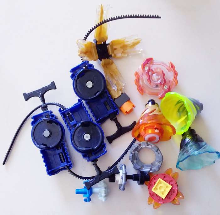 3 Beyblade Launchers with Various Spinners