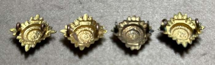 RHODESIA CROWNS AND PIPS - 4 BRASS PIPS WITH RED ENAMEL