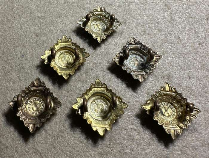 RHODESIA CROWNS AND PIPS - 6 BRASS PIPS WITH RED ENAMEL