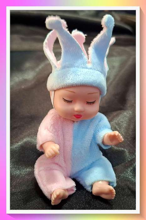Pretty Pink and blue harlequin design winter pocket baby