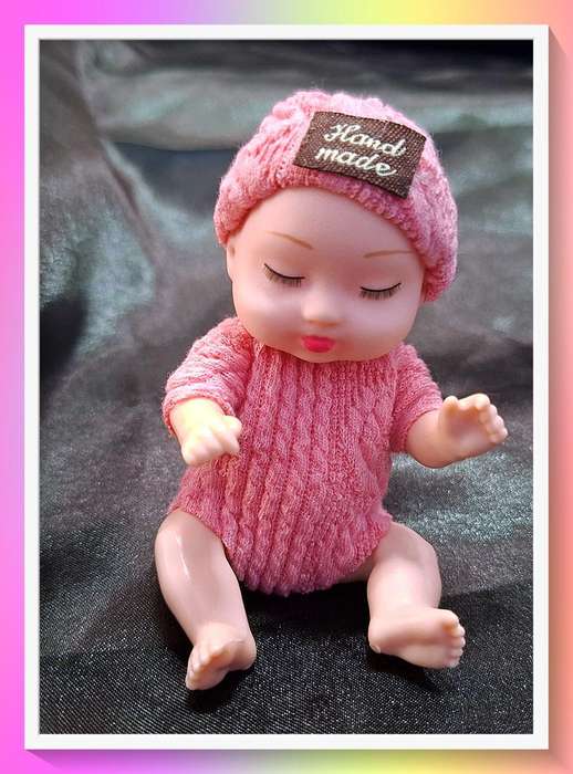 Adorable pink beanie pocket baby Doll