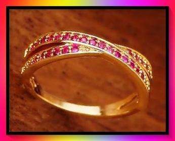Beautiful goldtone crossover design ring with crystal insets size 8