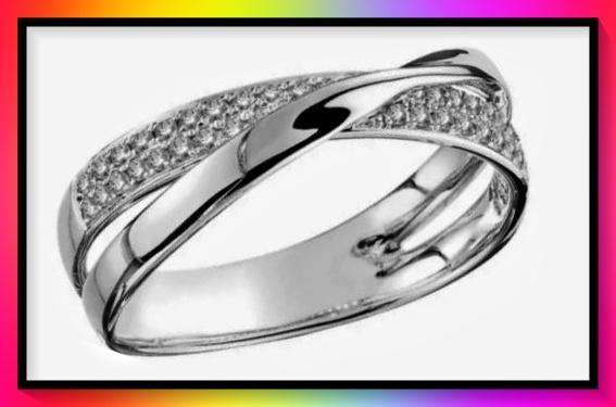 Lovely silvertone crossover ring with clear crystal insets size 7