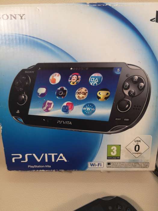 Complete PS Vita With Charge Cable, Booklets, Game and Original Box