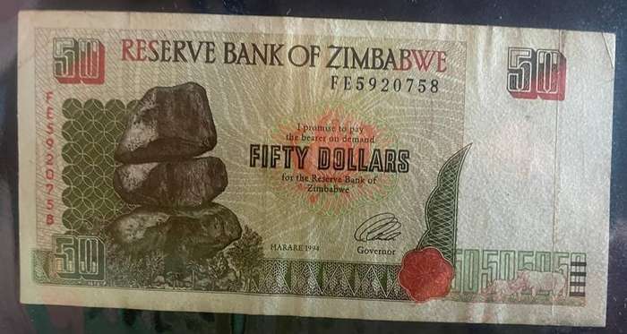1994 ZIMBABWE 50 DOLLARS NOTE - LEONARD TSUMBA GOVERNOR + RHINO LOGO