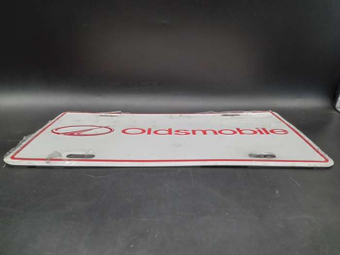 Vintage ! Oldsmobile - White Red Metal Embossed - Dealership License Plate