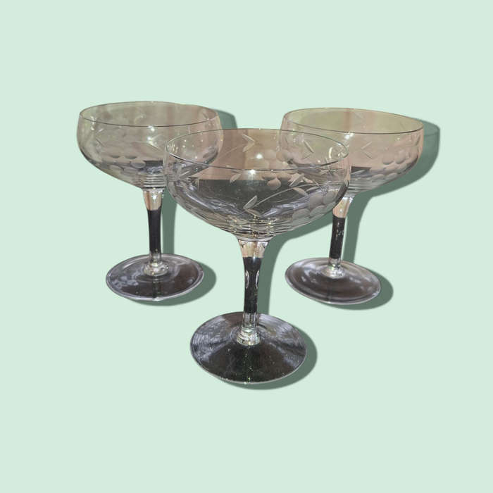 Champagne glasses with etched grapes motif