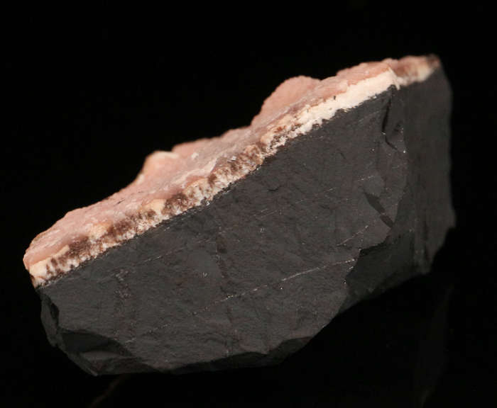 Rhodochrosite on Matrix, N'Chwaning II Mine, Kalahari Manganese Field, Northern Cape, South Africa.