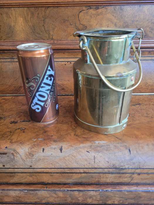 TWO VINTAGE BRASS MILK CANS.  FOR USE IN THE KITCHEN AND DISPAY AS CONVERSATION PIECES