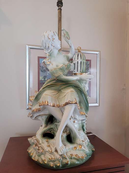 GILDED LADY WITH A BIRD FROM A CAGE, CERAMIC-FITTED TO BE A LAMP-FIGURINE 55CM HIGH