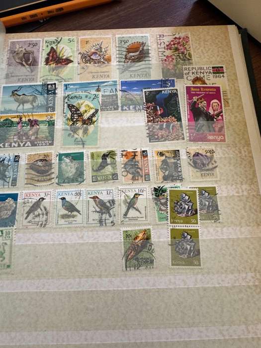 Malaysia,Switzerland ,Morocco, Kenya,Rwanda, Volta,Argentina Stamps in album