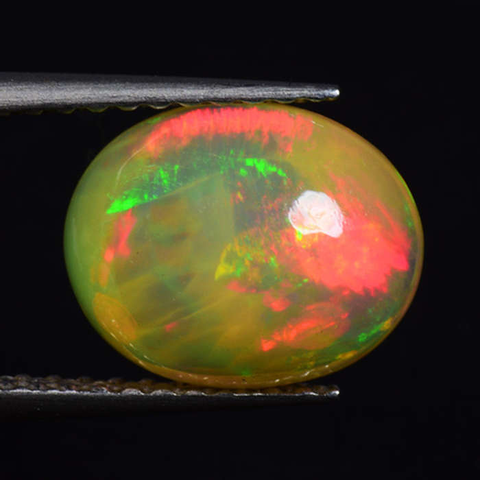 1.65 Ct. Pretty Oval Cab cut 10 x 8 mm Natural AAA Multi Color Play Opal