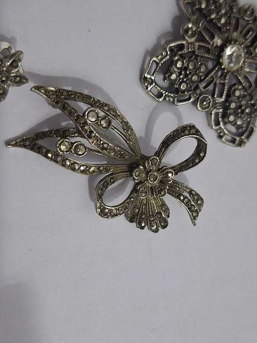 3 x Brooches and 1 pair clip on earrings