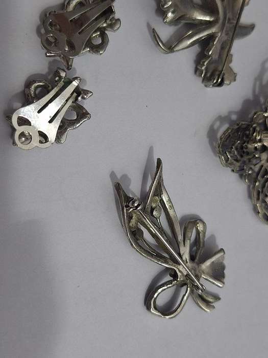3 x Brooches and 1 pair clip on earrings