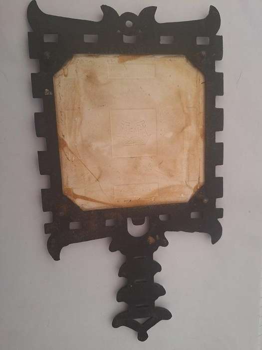 Vintage cast iron trivet with tile
