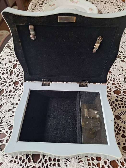 Beautiful light blue musical jewelery box with photo slot top