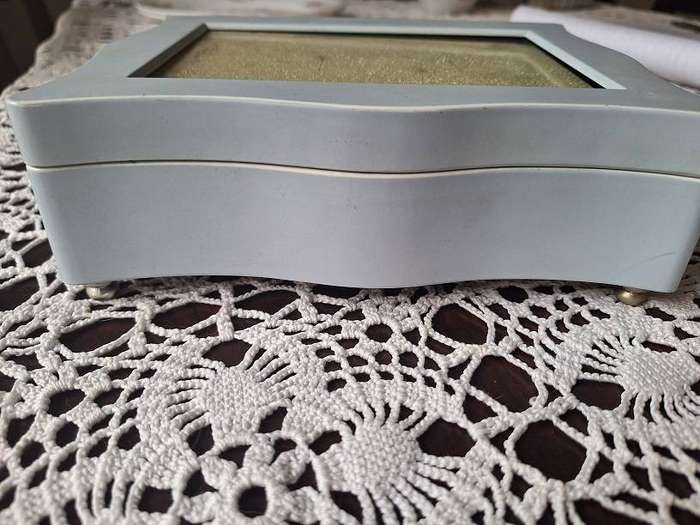 Beautiful light blue musical jewelery box with photo slot top