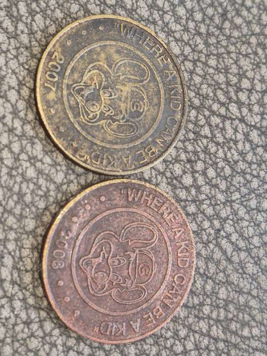 2 x Chuck. E. Cheese Solid Brass Tokens, 2007 and 2008 featuring rat mascot and slogan!