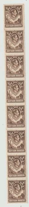 Northern Rhodesia  strip of 8 1/2d KGVI stamps with paper join. Scares.  See Scans.