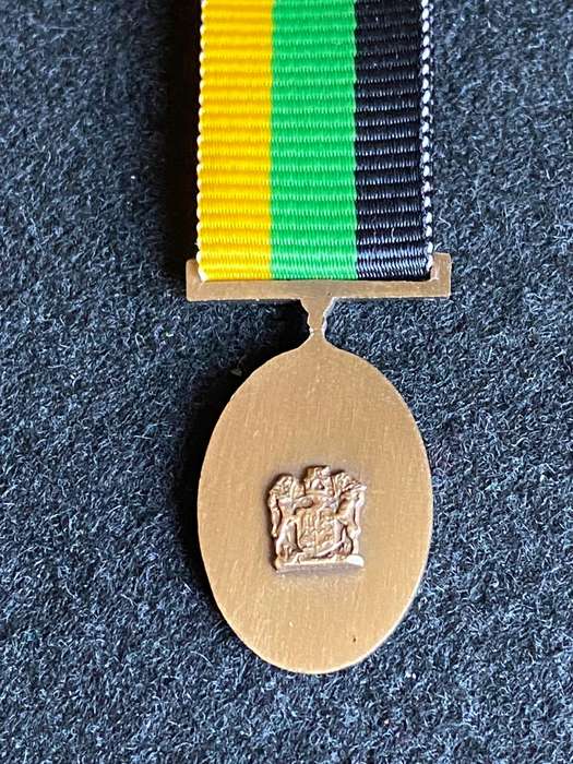 MINIATURE MK 10 YEARS SERVICE MEDAL IN BRONZE