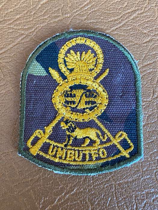 SWAZILAND ARMED (ARMY) CAP BADGE