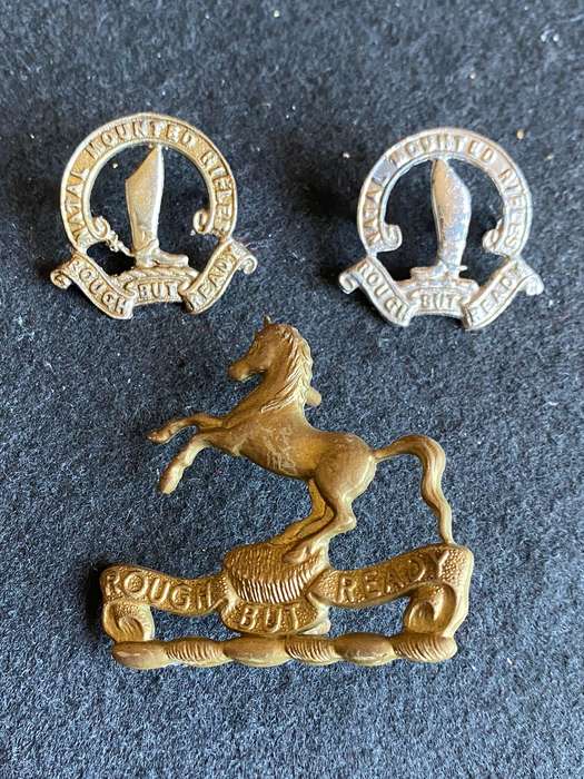 NATAL MOUNTED RIFLES CAP BADGE-WORN SINCE 1965-SOLD WITH 2X COLLARS-LUGS INTACT