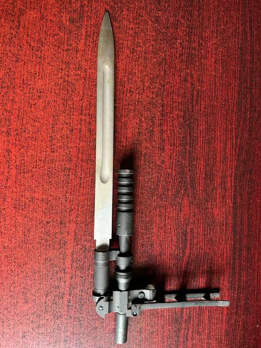 RUSSIAN S.G. SIMONOV DESIGNED THE SKS 45 RIFLE,WHICH INCLUDED A VERY DISTINCTIVE KNIFE BAYONET- THE