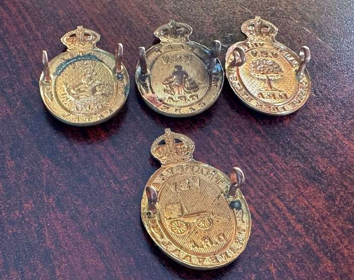 Rifle association badges for Cape, Free State, Transvaal and Natal. Lugs intact
