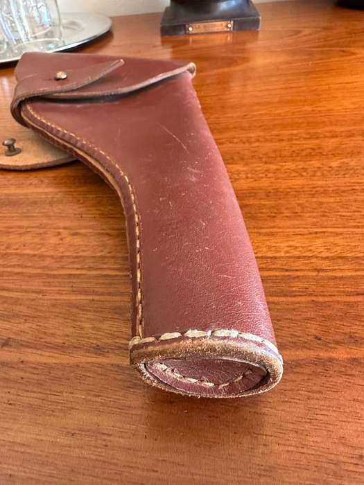 Leather holster for the long barrel Webley revolver. Good condition. No markings.
