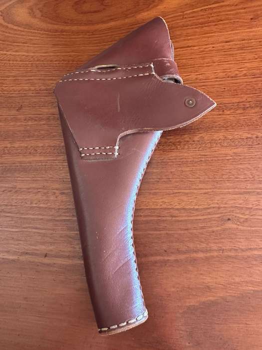 Leather holster for the long barrel Webley revolver. Good condition. No markings.