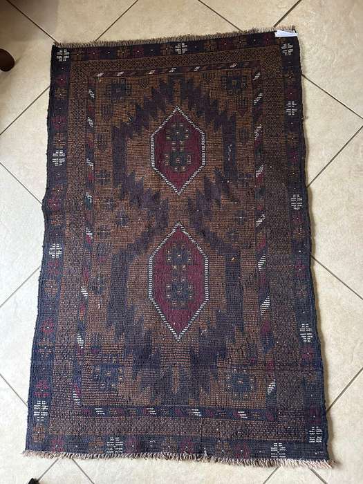 Authentic Balouchi handmade Persian carpet. Measures 1410 X 860 mm. Condition unused