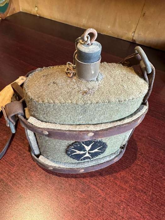 WW2 water bottle,with St John,s (medics) patch,stitched onto the cover. The bottle is in complete an