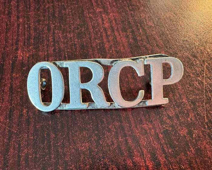 Orange River Colony Police shoulder title. Worn 1908- 1910. 2 Lugs. White metal.