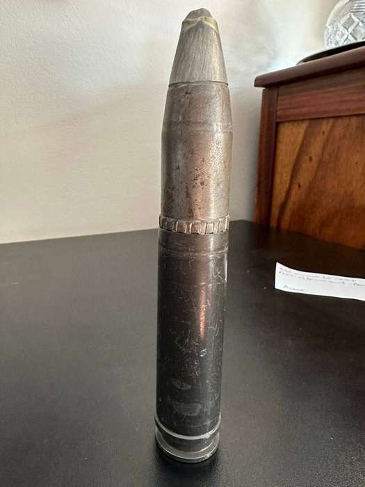 30mm. Round. Deactivated. Height 20 cm.
