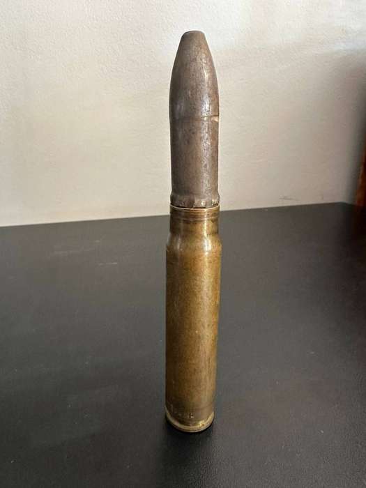 20mm. Round. Deactivated. Height 18 cm.