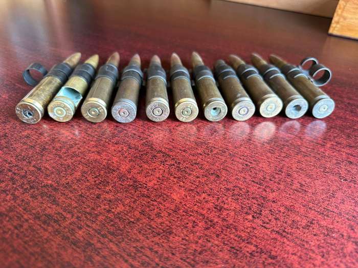12,7 mm. or .5 Cal. machine gun belt with disintegrating links deactivated.