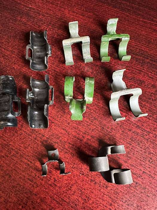 Selection of machine gun belt clips. 9 In total.