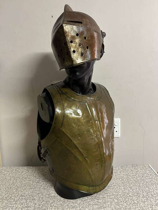 Reproduction Roman helmet and armour fitted onto a mannequin with a light inside the helmet. Sold as