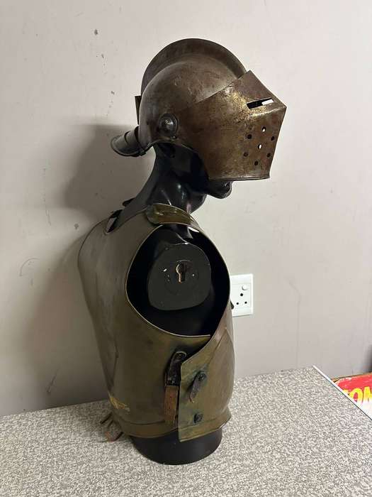 Reproduction Roman helmet and armour fitted onto a mannequin with a light inside the helmet. Sold as