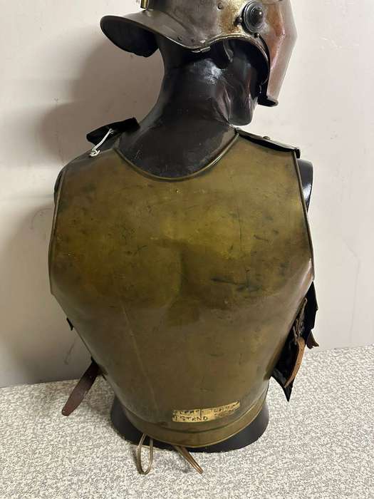 Reproduction Roman helmet and armour fitted onto a mannequin with a light inside the helmet. Sold as