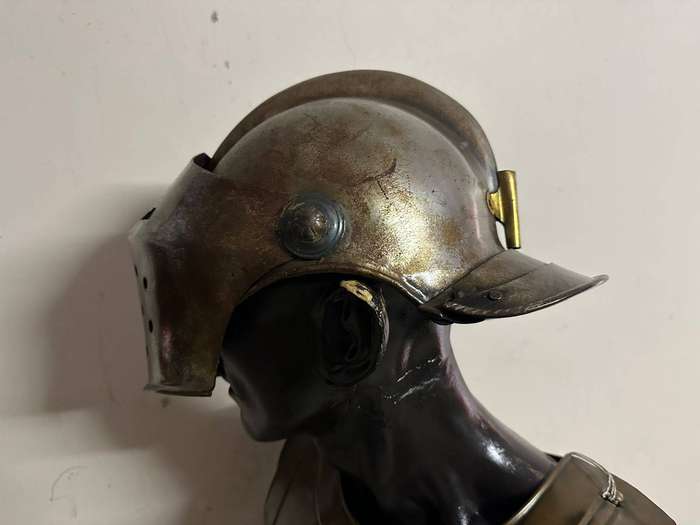 Reproduction Roman helmet and armour fitted onto a mannequin with a light inside the helmet. Sold as