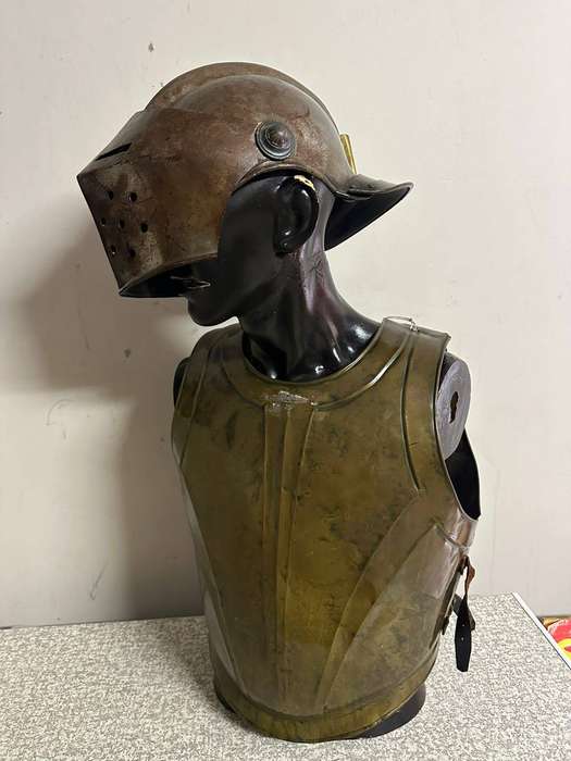 Reproduction Roman helmet and armour fitted onto a mannequin with a light inside the helmet. Sold as
