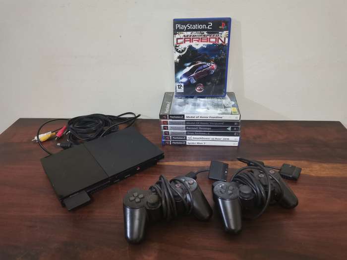 PlayStation 2 Console with Memory Card, Controllers and 7 Games